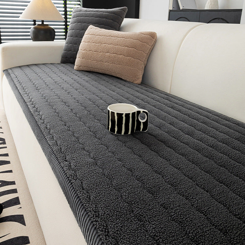 Soft quilted lambswool sofa cover with a corduroy trimmed edge