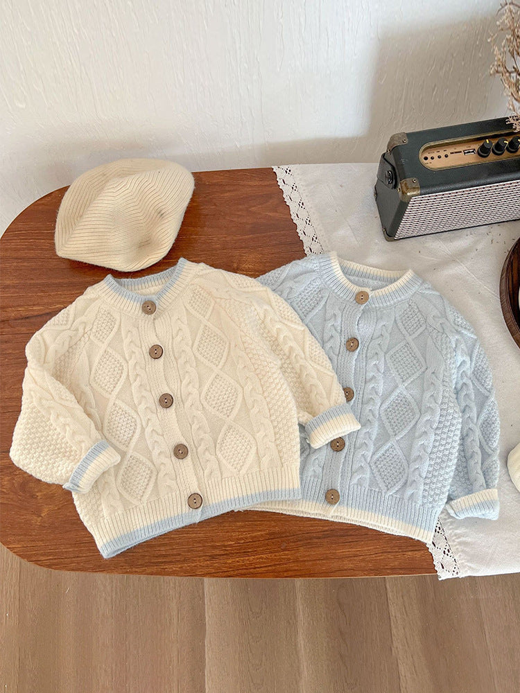 Knitted suspender baby pants showing the adjustable shoulder straps