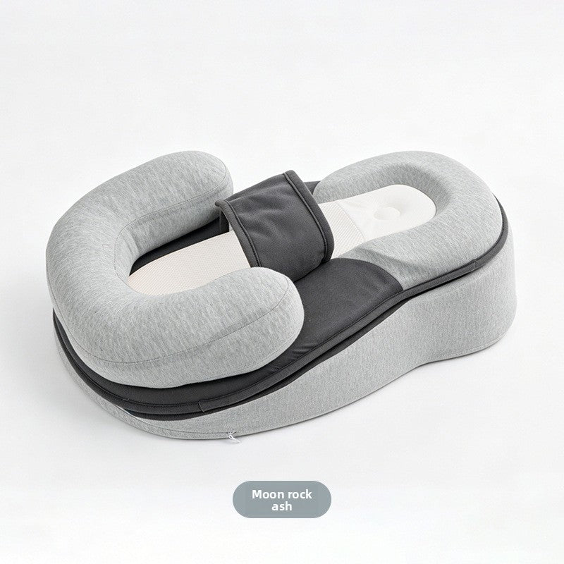 Side view of the grey baby lounger showing the sloped base and the U-shaped side bolster