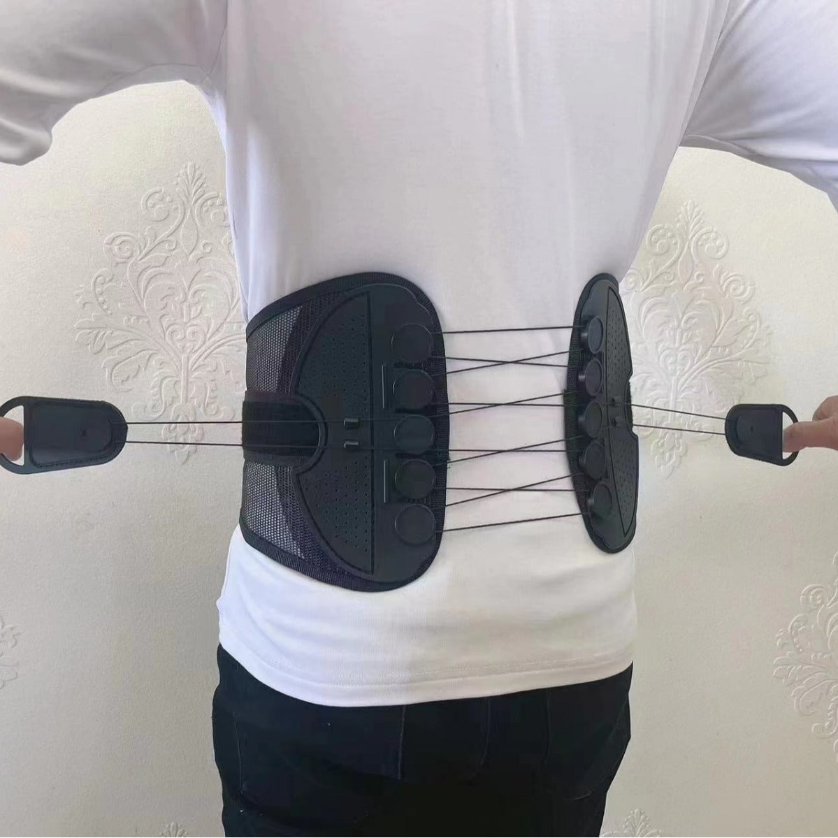 Breathable black mesh panels of the lower back support belt