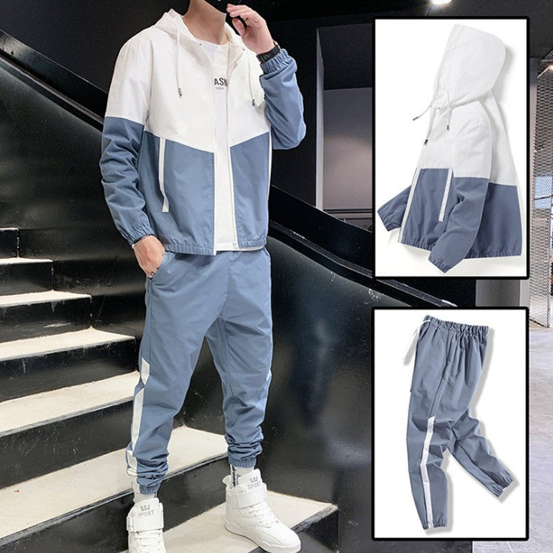 Feature highlight close-up of the jacket zip pull and collar of the tracksuit