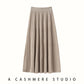 Beige ribbed knit tiered midi skirt with a wide ribbed waistband, flat front view on a white background