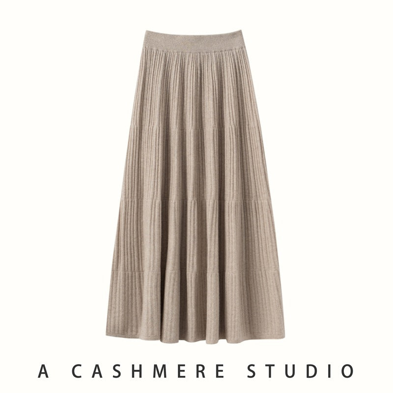 Beige ribbed knit tiered midi skirt with a wide ribbed waistband, flat front view on a white background
