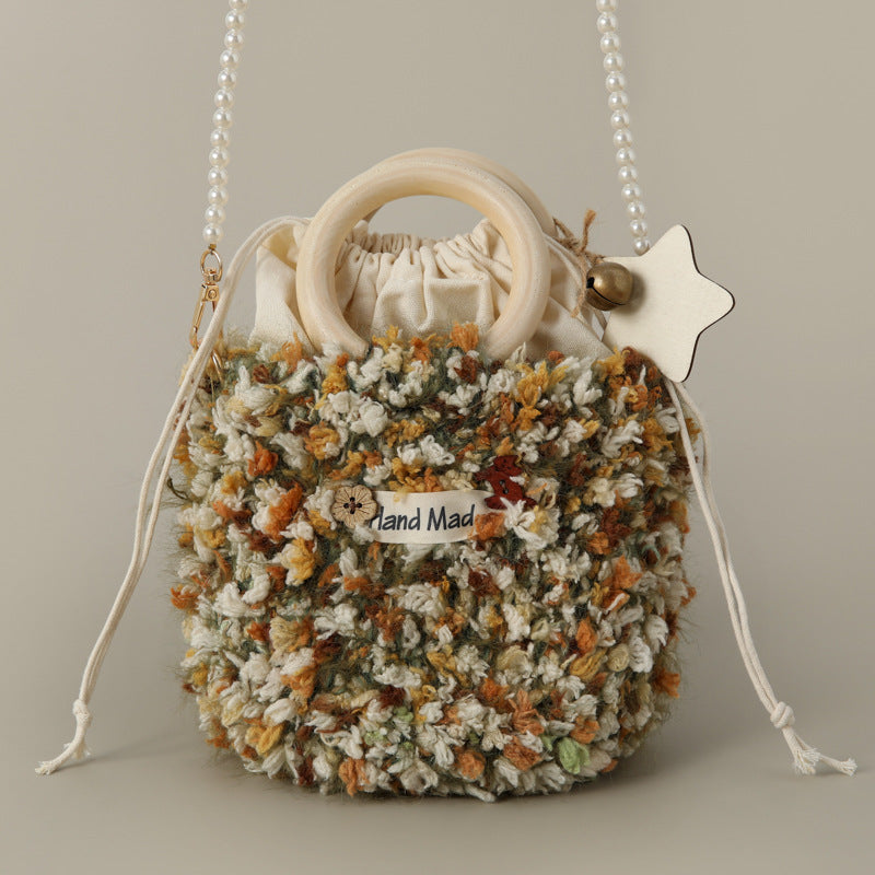 Multicolor wool knit crossbody bag with wood round handle and pearl bead strap