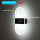 LED wall sconce shown next to a hand for size reference