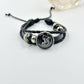 Braided cord charm bracelets arranged to show the range of celestial designs