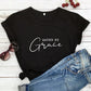Flat lay of the Saved by Grace cotton tee with denim for a casual weekend look