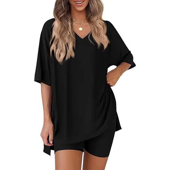 Oversized V neck loungewear top with side slits and matching milk silk shorts, model view