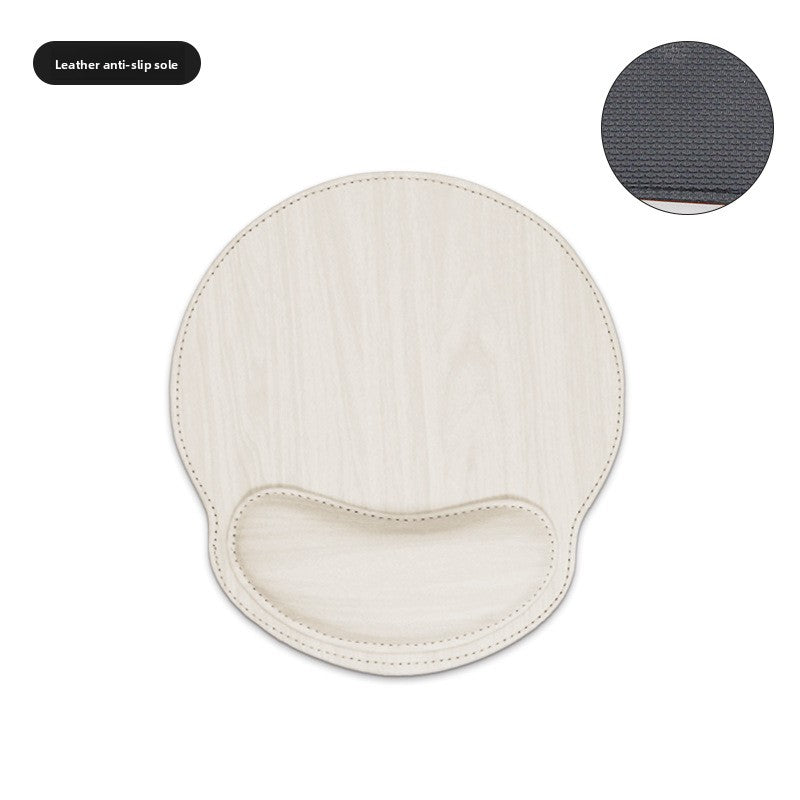 Memory foam wrist rest mouse pad next to a keyboard on a desk
