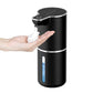 Black sensor soap dispenser dispensing a dome of foam onto an open hand, level window in view