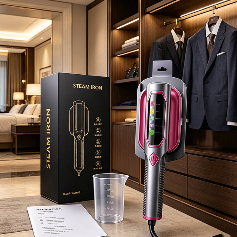 Gray and fuchsia handheld garment steamer in a holder beside its box, water cup and manual in a wardrobe