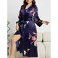 Close up of the glossy satin fabric and floral print on the kimono robe
