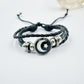 Braided cord bracelet pair presented as a sun and moon couple gift