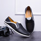 Cowhide leather moccasin loafer with elastic side gussets and a flat rubber sole