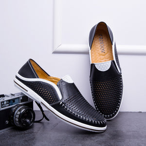 Cowhide leather moccasin loafer with elastic side gussets and a flat rubber sole