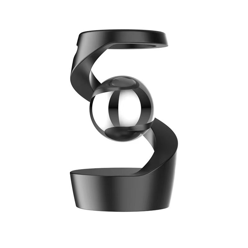 Alloy metal levitating desk ornament with a bead spinning in the air gap