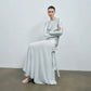 Angled view of the long mint satin gown showing the flared fishtail skirt