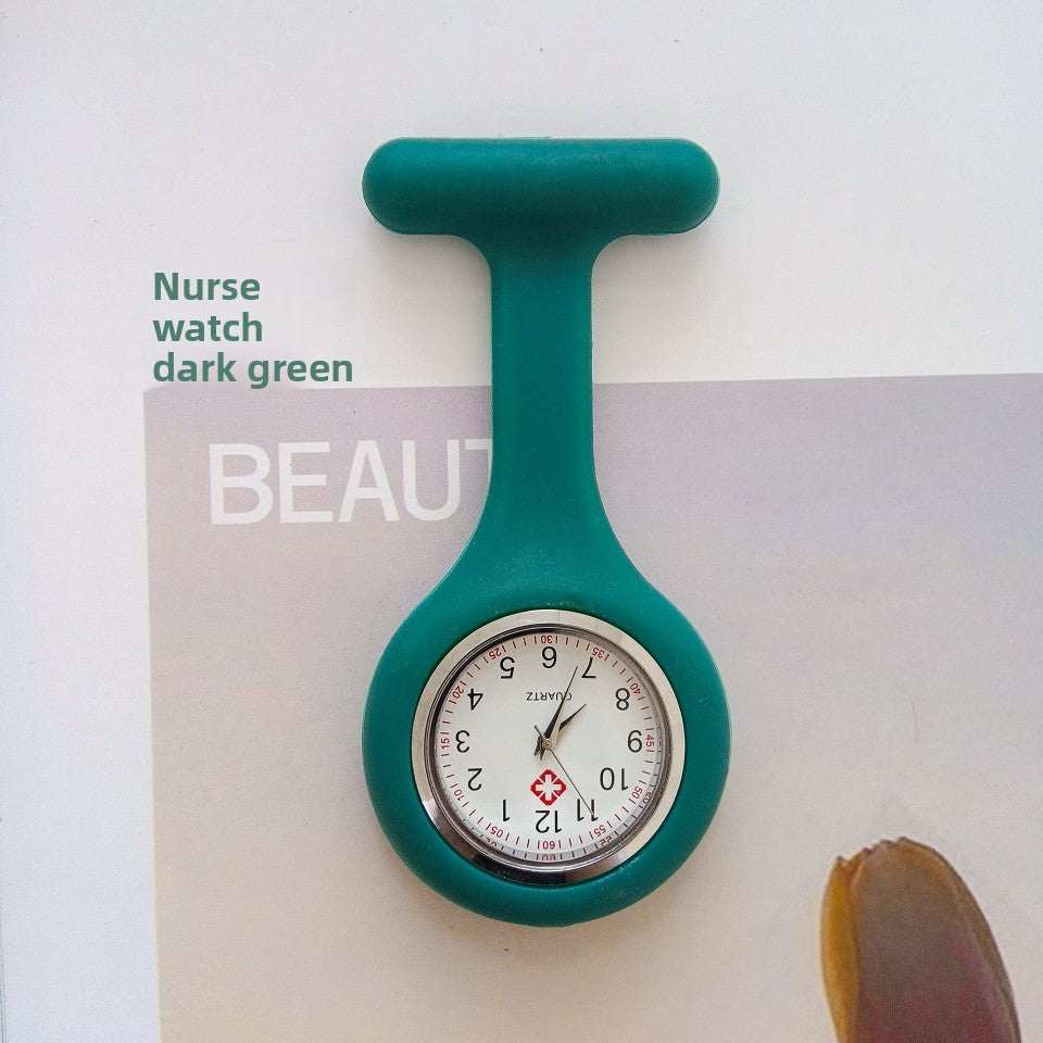 Dark green silicone nurse fob watch hanging from its stainless steel brooch pin
