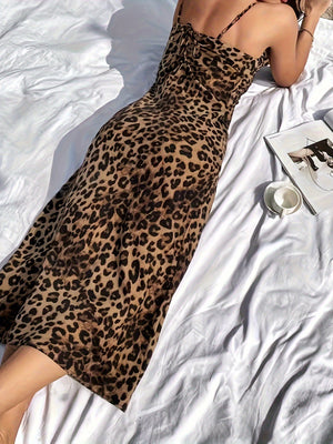 Back view of leopard print slip dress showing the low open back and thin shoulder straps