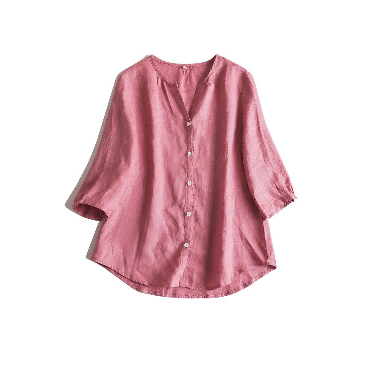 Moss green linen V neck shirt with a soft neckline worn over trousers
