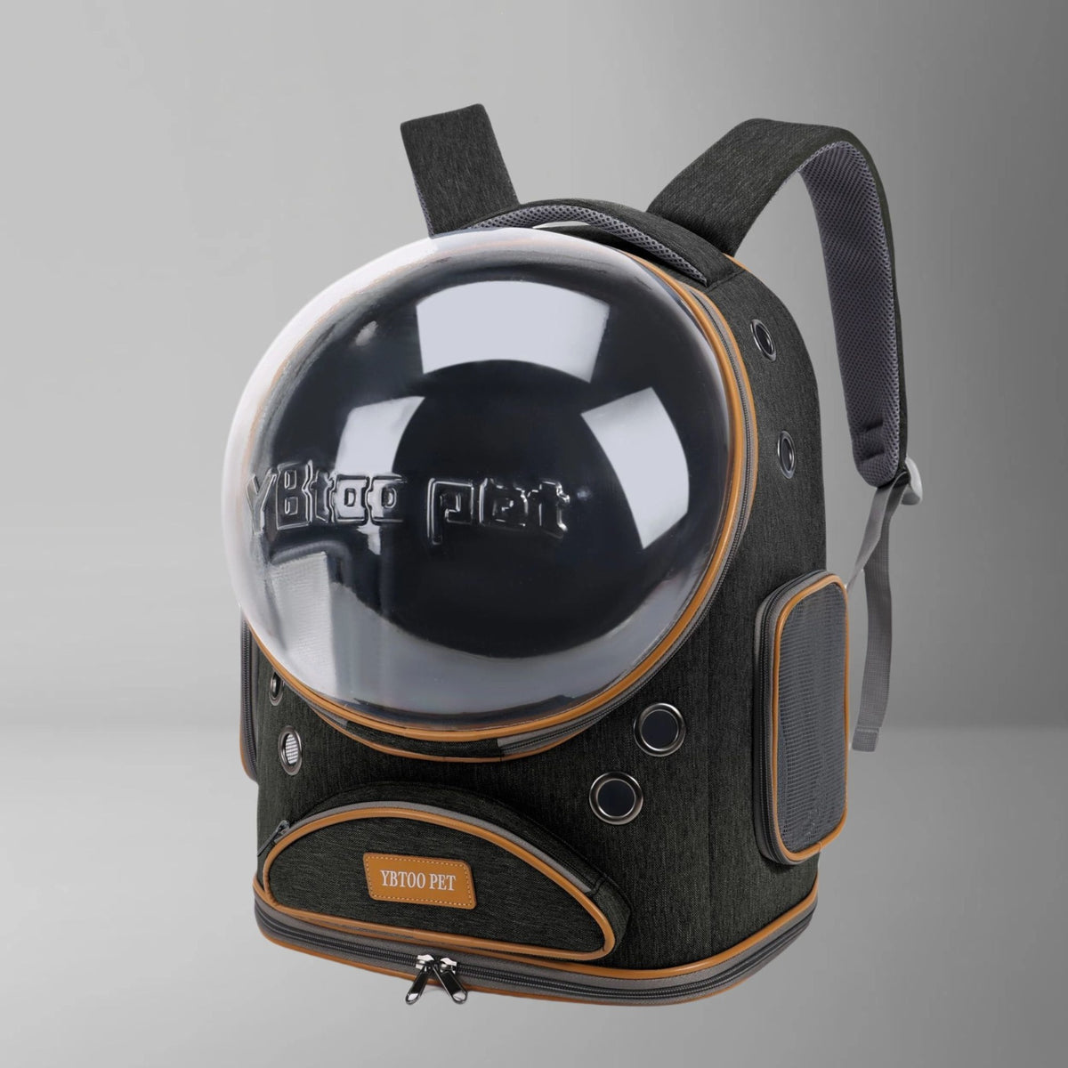 Black space capsule cat carrier backpack with large clear dome, vent holes and tan trim on a gray background