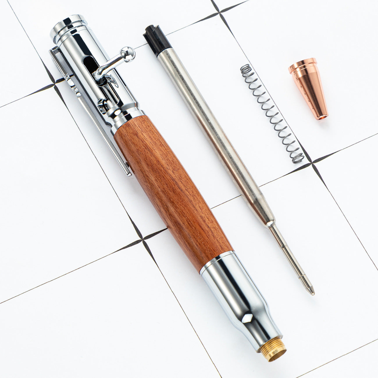 Bolt action ballpoint pen with a turned wood barrel and rifle style metal bolt lever