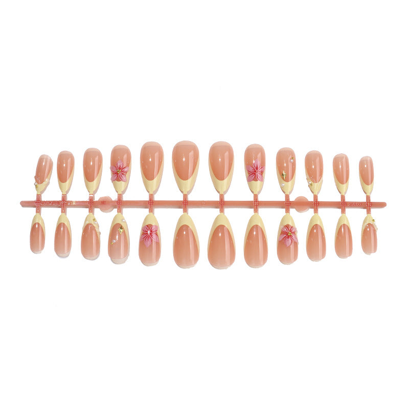 Full set of 24 almond French nails in graduated sizes on the tray