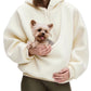 Model holding a small dog inside the pouch of the pink plush fleece hoodie