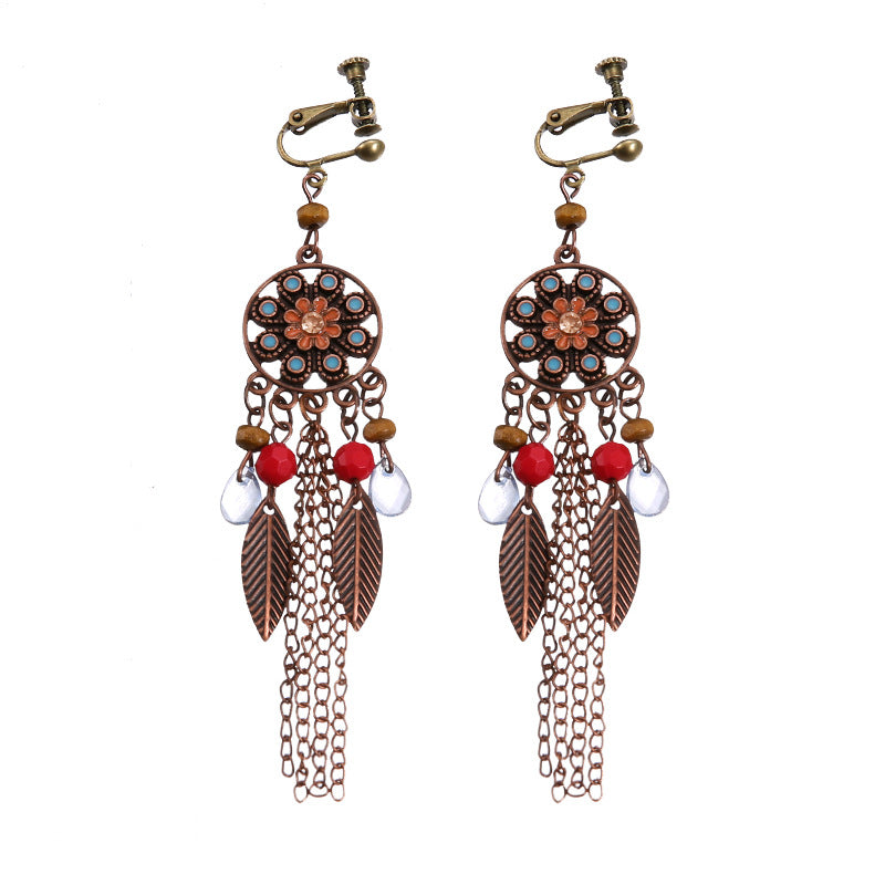 Bohemian vintage clip-on tassel drop earrings on a zinc alloy frame, handmade boho pair on white studio background