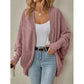 Black mid length open front cardigan with a soft ribbed knit on a model