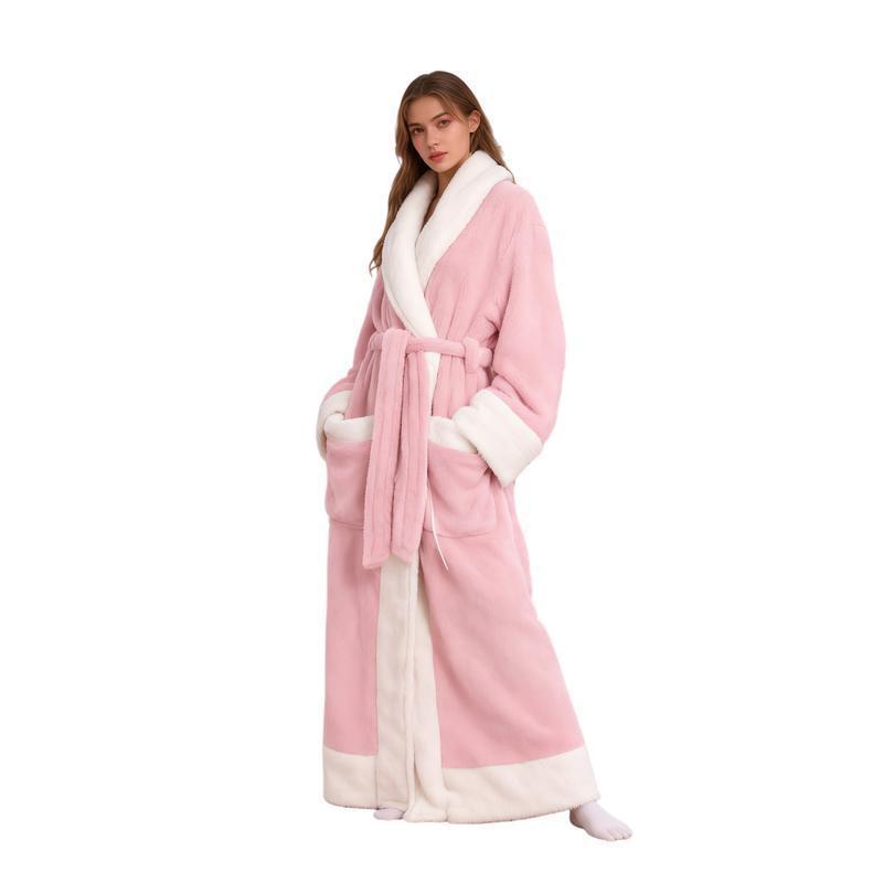 Woman in a long pink flannel bathrobe with white shawl collar and two front pockets, ankle length