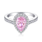 Pear cut pink stone halo ring, hand inlaid clear pave, polished sterling silver band on white