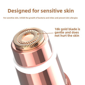 Close up of the round 18K gold plated foil shaver head on the rose gold and white body