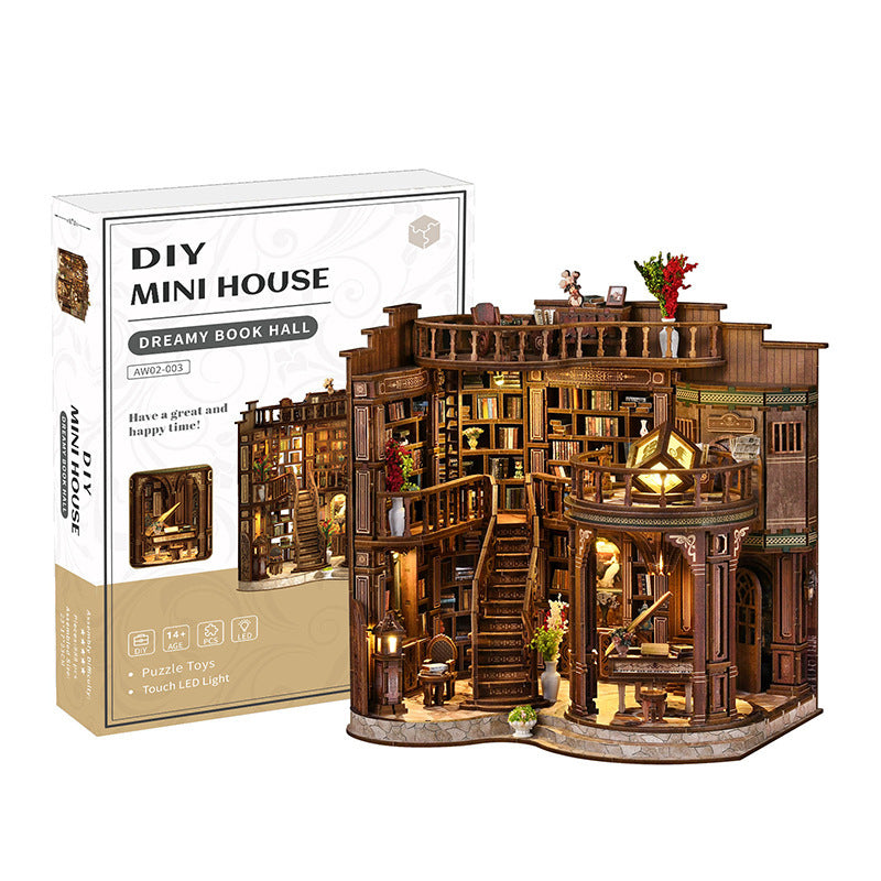 Retail box beside the finished wood Dreamy Book Hall miniature model kit for ages fourteen and up