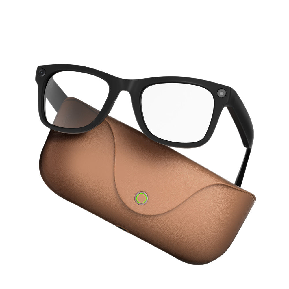 Black MT5 smart glasses with clear lens and temple camera resting on a brown leather charging case
