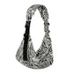 Printed one-shoulder baby sling carrier shown in soft natural light