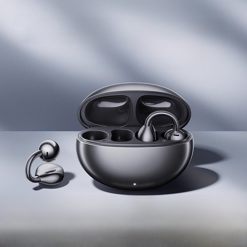 Beige warm skin open ear clip earbuds shown in their charging case