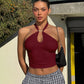 Fitted halter crop top shown styled with trousers for a going-out look