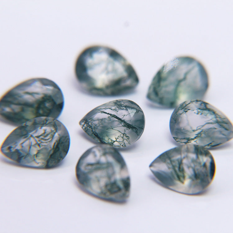 Loose moss agate pears on white, natural green dendrites suspended in pale chalcedony