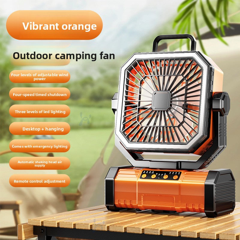 Orange camping fan with an oscillating head and remote on the larger battery base