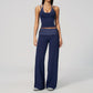 Model in a cropped camisole and wide leg fold over waist pants set, navy with white polka dots