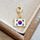 Korea enamel country flag keychain charm on a gold tone lobster clasp for keys and bags
