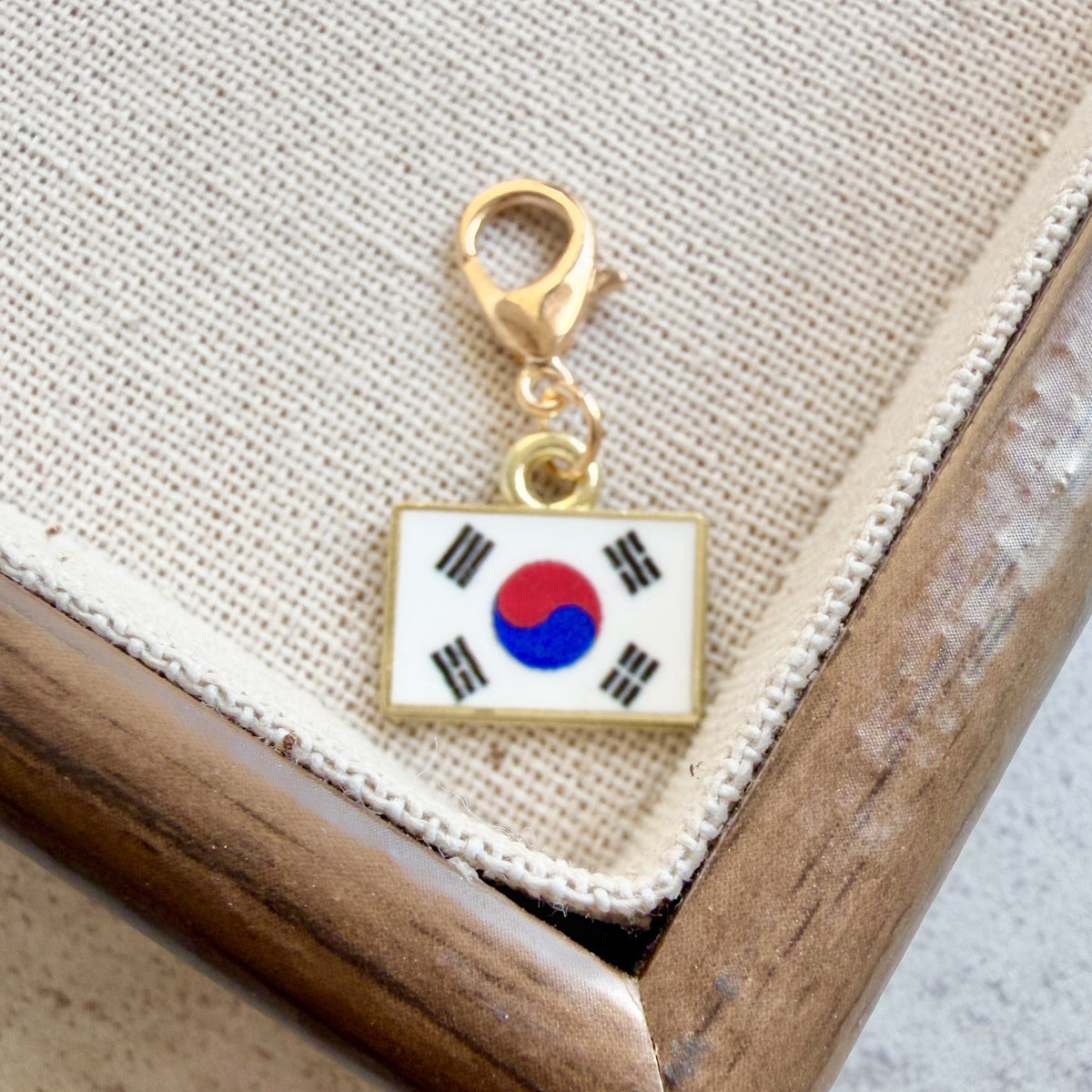 Korea enamel country flag keychain charm on a gold tone lobster clasp for keys and bags