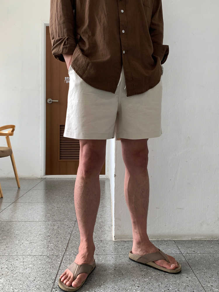 Material close-up showing the light breathable weave of the casual shorts
