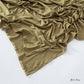 Solid tone modal cotton headscarf wrap laid in soft folds showing the fine jersey knit surface