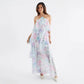 Polka dot chiffon maxi dress styled with a clutch, front view