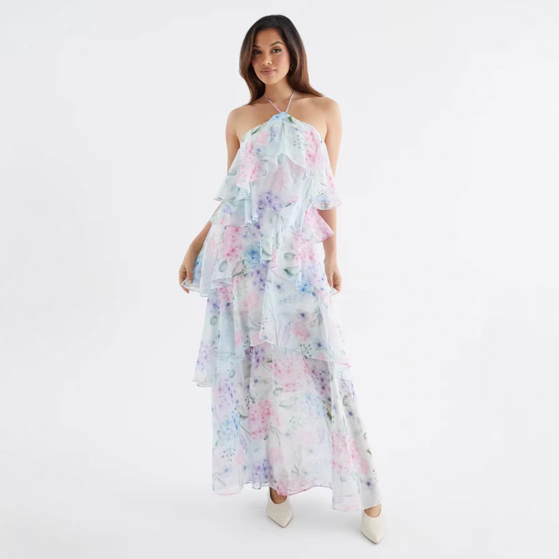Polka dot chiffon maxi dress styled with a clutch, front view