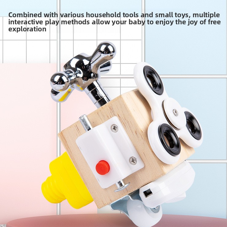 Wooden Unlock busy block with chrome tap, yellow spout and spinner discs against a tiled wall backdrop