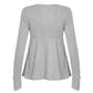 Back view of a gray long sleeve babydoll top with a gathered waist seam and deep cuffs on a plain background