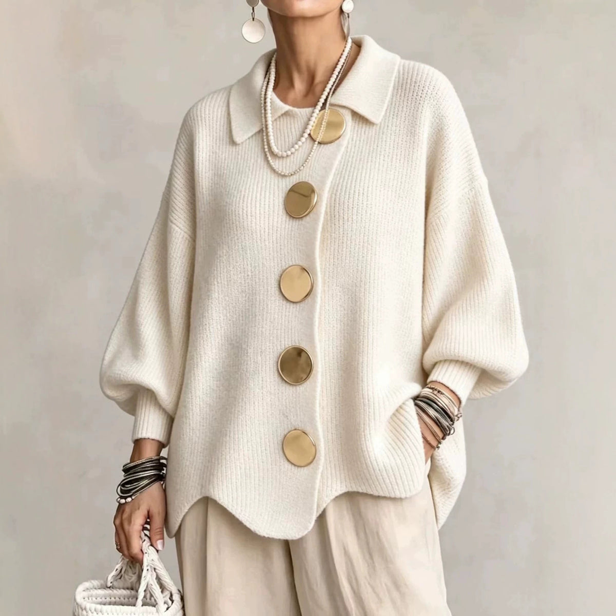 Cream ribbed knit top with a collar and gold tone metal buttons, Apricot option, size M